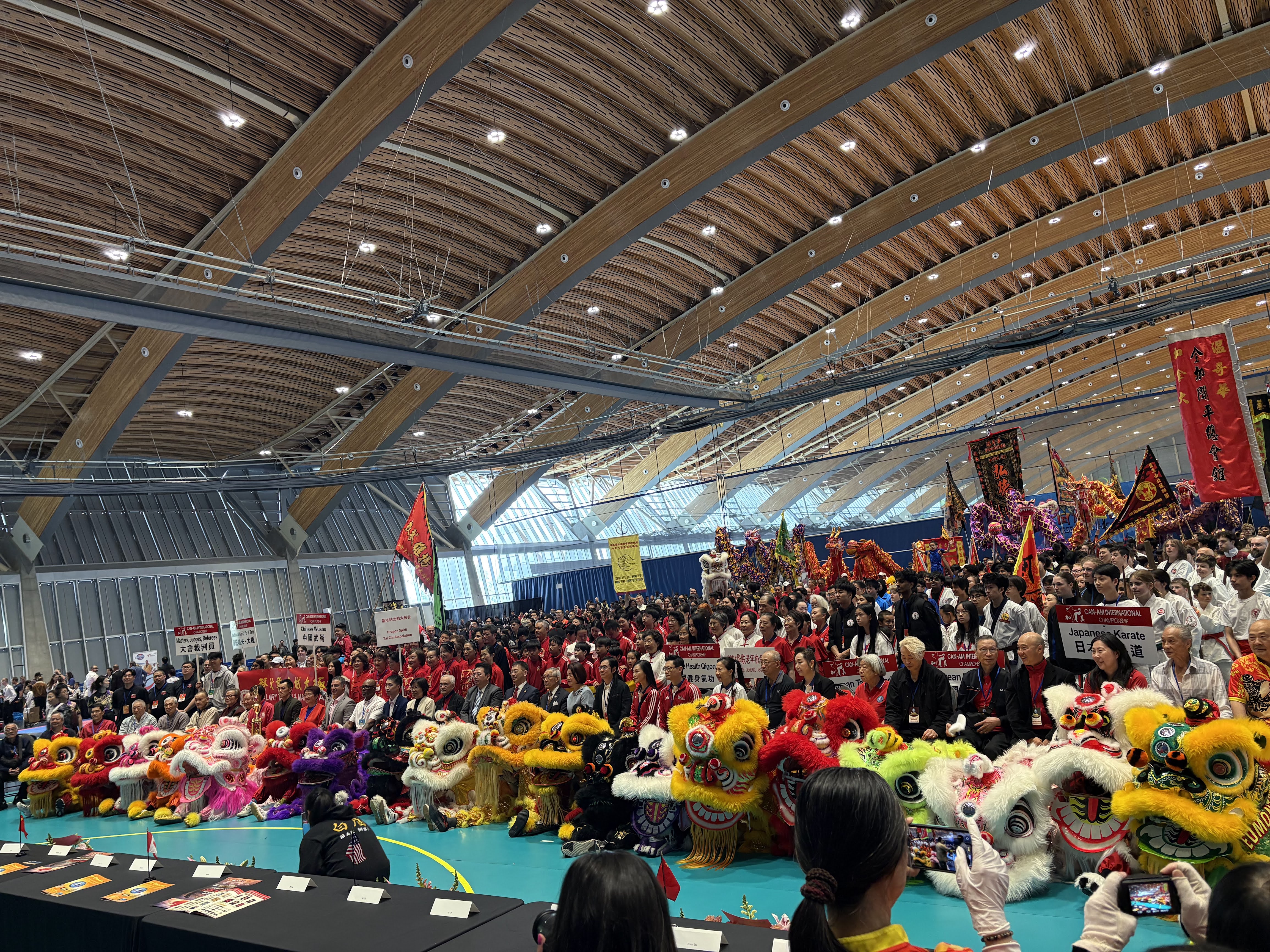 Lion dance team performing outside a business storefront at a grand opening