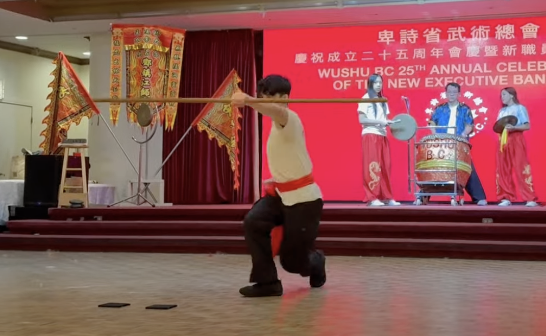 Kung fu student demonstrating a form during a martial arts exhibition
